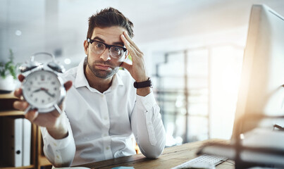 Wall Mural - Frustrated, businessman and portrait with clock for deadline, time management or crisis at office. Young, man or employee with alarm or late in stress, anxiety or burnout for pressure at workplace