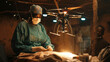 © NooPaew - A surgeon in a humanitarian effort, where robotic drones deliver supplies and assist in surgeries in areas too dangerous for human presence