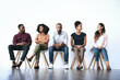 © peopleimages.com - Waiting room, business people and job seeker with discussion for interview, work opportunity and hiring. Row, candidates and patience with tips for creative agency, recruitment and employment process