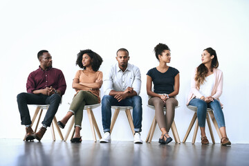 Canvas Print - Waiting room, business people and job seeker with discussion for interview, work opportunity and hiring. Row, candidates and patience with tips for creative agency, recruitment and employment process