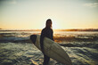 © StarDweller/peopleimages.com - Portrait, surfer or man with surfboard in water at beach for adventure and tropical vacation. Waves, tourist or person for surfing at ocean with fitness, mockup space and activity for hobby or sunset