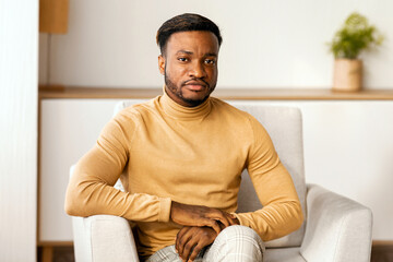 Aufkleber - Confident African American Businessman Looking At Camera Sitting On Sofa Indoor. Business People Concept