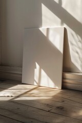 Poster - A picture frame sitting next to a window on the floor, perfect for decorating or framing