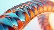 © Igor - Close-up photo of intricate metal object adorned with blue and orange design against a pale blue backdrop