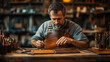 © Lumos Studio - A Leather Craftsman Hand-Stitching a Wallet with Tools