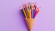 © Igor - A colorful ice cream cone filled with pencils on a purplish backdrop, featuring all the hues of the rainbow