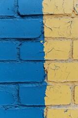 Poster - Brightly painted brick wall featuring yellow and blue sections in a vibrant urban setting