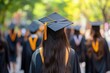 © MUdaylah - Rearview of university graduates wearing an academic gown on commencement day. Education stock photo with generative ai