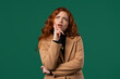 © kohanova1991 - Portrait,curious analyzing woman in green studio.Mindful girl searching solution