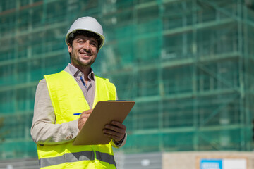 Construction manager or architect with reflective vest white helmet reviewing the construction of homes, safety inspector reviewing work, work safety real estate future professions, housing project