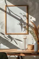 Poster - A picture frame hangs on the wall above a wooden table, ready for display