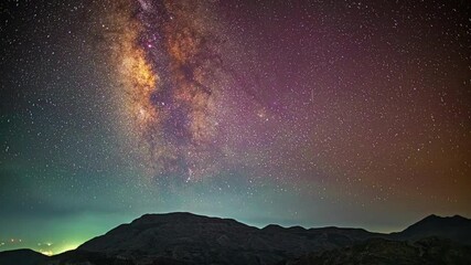 Wall Mural - Milky Way time lapse from the Skinakas Observatory on Crete, Greece with purple airglow over the mountains