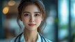 © Aliaksandra - A close-up portrait of a young female doctor, exuding professionalism with a stethoscope, against a blurred background