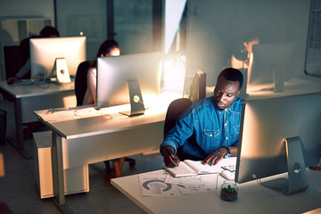 Poster - Night, notes and man with computer in office for research, planning and data at digital agency. Dark, coworking space and graphic designer at desk with online ideas, overtime and internet connection