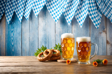 Oktoberfest beer and pretzels, featuring Bavarian decor and festive elements, blue-checkered flags