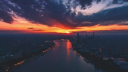 Poster - The vibrant colors of the sunset cast a warm glow over the city skyline, reflecting beautifully on the river’s surface during twilight.