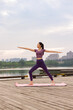 © Blue Jean Images - Young Woman Doing Yoga In A Park
