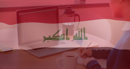 Poster - Iraqi flag image over person working on laptop and holding coffee cup