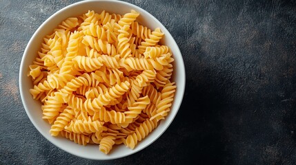 Spiral Pasta in a White Bowl on a Dark Background