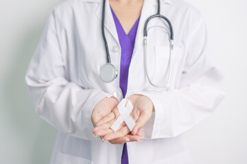 Wall Mural - Stop Violence Against Women and November Lung Cancer Awareness month. Doctor with White ribbon in hospital. Healthcare and World Cancer day concept