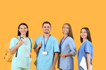 Canvas Print - Group of medical students on yellow background