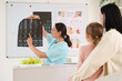 © Pixel-Shot - Mother and her daughter visiting female osteopath with x-ray scan in clinic