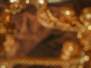 Glittering brown bokeh for a celebration or new year background.        