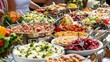 © BerkahStock - A vibrant buffet display featuring a variety of fresh salads and dishes for guests.