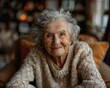 © serg3d - A smiling elderly woman looking at the camera. AI.