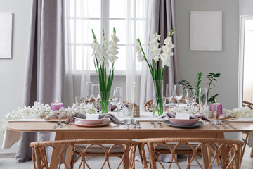 Sticker - Beautiful table setting with white Gladiolus flowers and burning candles in room