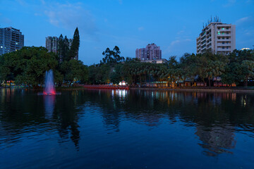 Wall Mural - Night view of city park, lake and woods