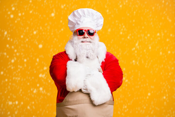 Poster - Photo of santa claus in chef culinary headwear cross hands cook x-mas christmas noel meal wear apron sunglass isolated over bright shine color background