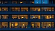 © mashimara - Lit office building windows glow warm against the blue evening, showing bustling city life and after-hours activity. Concept: Urban work culture.