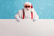 © deagreez - Portrait of his he nice attractive funky amazed stunned white-haired Santa holding in hands copy space board advert ad attention isolated over bright vivid shine vibrant blue color background