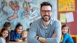 © Yeivaz - Portrait of smiling male teacher in a class at elementary school looking at camera