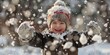 © Annamorphosis - A young child is playing in the snow, wearing a hat and gloves