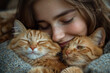 © Oleksandr - A young couple hugging their two cats,