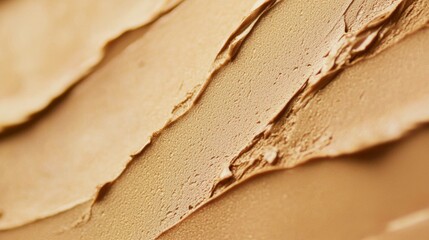 Poster - Liquid foundation makeup cream is spread out on a surface, creating a smooth and luxurious texture. The cream's delicate texture and even application are highlighted
