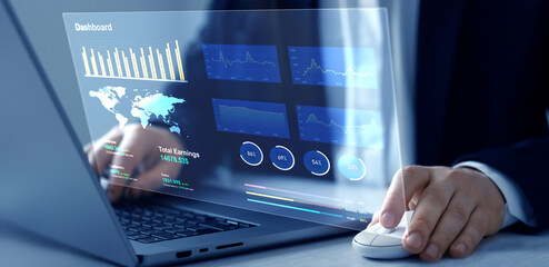 Leinwandbilder - Businessman using computer dashboard analyzing sales data and financial report. Financial Management data System KPI connected in database for follow earnings,operations and sales data.