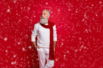 Poster - Profile side photo of one retired person putting his palms in pockets wearing white sweater pants trousers isolated over red background