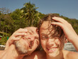 © fStop - Portrait happy father and son laughing and hugging on sunny beach, Saint Vincent and the Grenadines