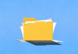 © fStop - Paperwork spilling out of folder on blue background