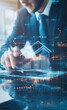 © DBFilms - A professional using a stylus on a laptop with holographic images of houses and financial graphs. The scene highlights technology's role in real estate analytics and data-driven decisions.