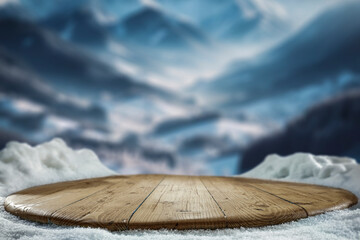Wall Mural - empty wooden table top coverd with snow with copy space and winter snowing trees and mountain backgr