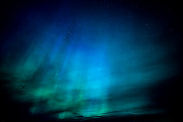 Wall Mural - northern lights dancing over dark specwe in the night. scenic view of a space area landscape with no