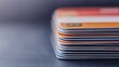 © CHOI POO - Stacked Credit Cards on a Dark Surface