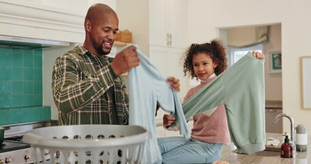 Wall Mural - Dad, child and folding clothes in home for house work, learning chores and bonding together. Father, young daughter and helping with laundry in kitchen for cleaning, development and weekend routine