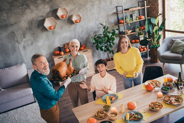 Poster - Above view portrait of big full family smile hold turkey tray thanksgiving gathering celebration dinner flat indoors