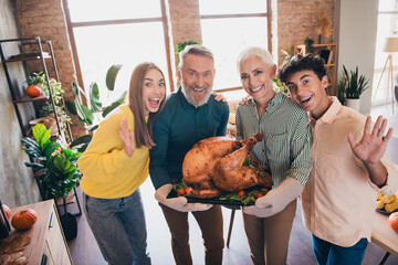 Poster - Portrait of big full family smile hug hold grilled turkey thanksgiving gathering celebration dinner flat indoors