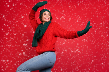 Poster - Photo portrait young woman dancing at party in scarf mittens looking copyspace isolated vibrant red color background